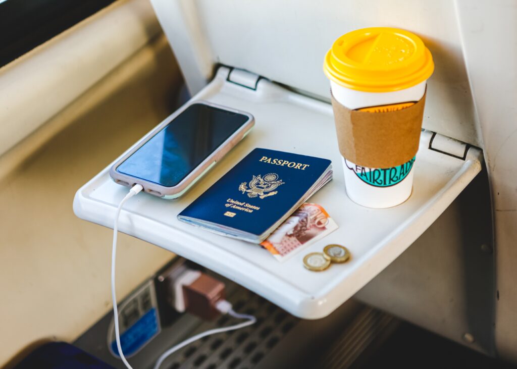 4 Reasons Why Traveling Is Important For Mental Health 2 Traveling On A Train With Passport Money Cell Ph 2023 11 27 04 52 38 Utc