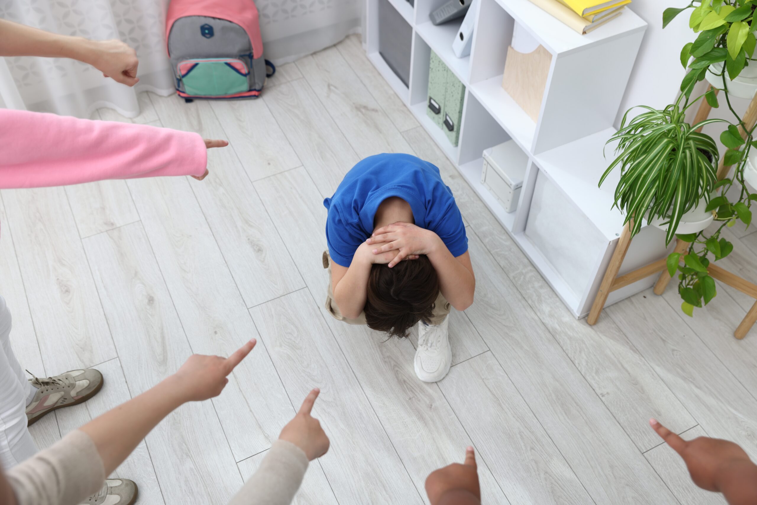 A young woman sits alone on the floor pulling her knees tightly to her chest This isolation highlights the social withdrawal often caused by overwhelming contamination phobia