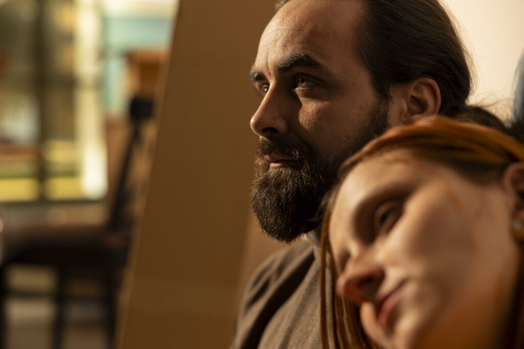 A couple in Cypress close but emotionally distant — one present, one lost in thought — capturing the invisible doubt of OCD relationship symptoms treated at Acceptance Path Counseling