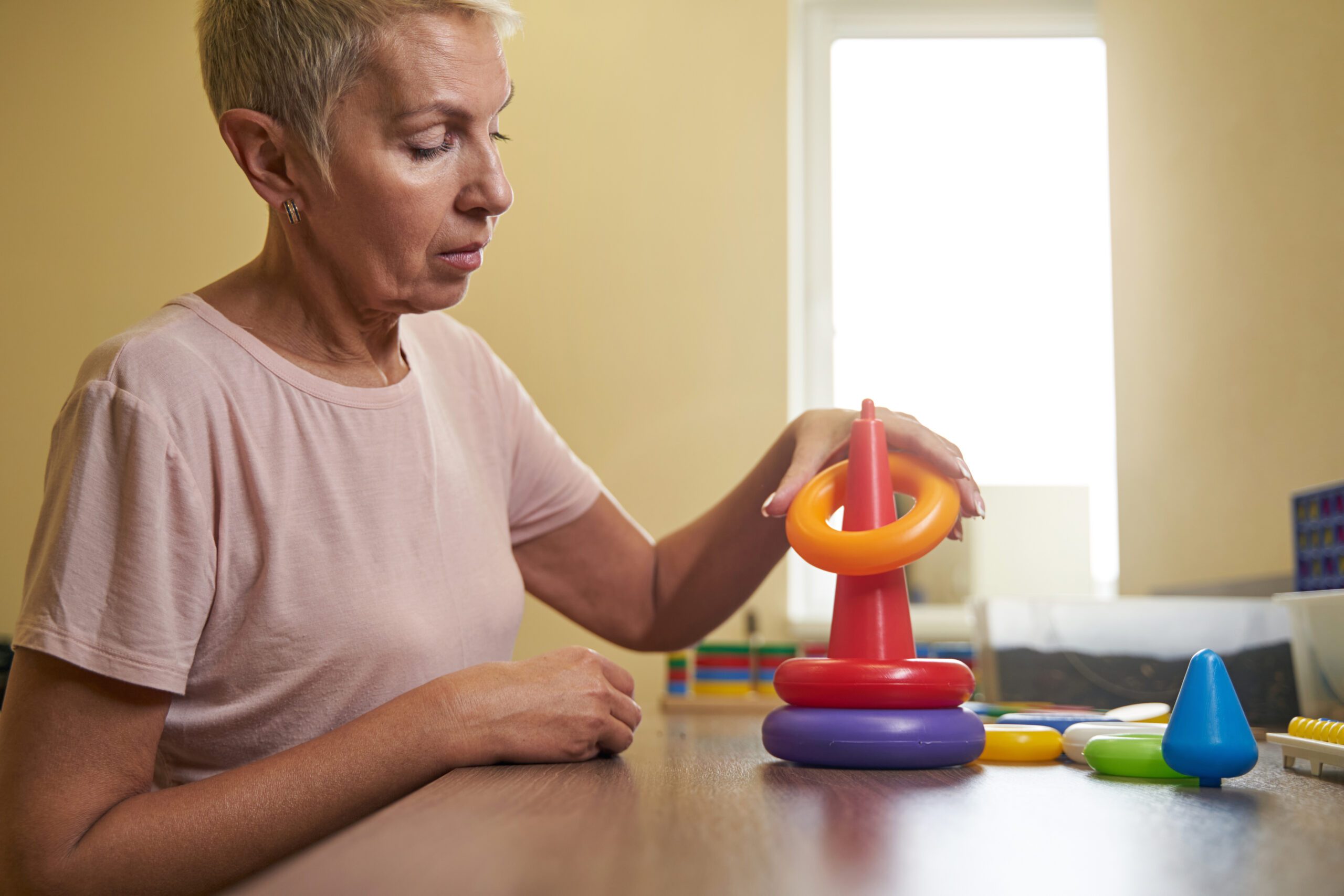 Photo of ergotherapy with stroke woman in rehab center Acceptance Path Counseling Illustrates critical workplace adjustments and effective adhd strategies for adults in busy environments