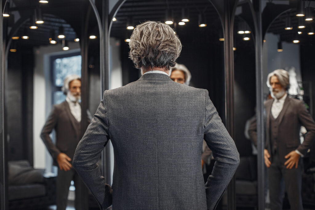 A professional in Champion Forest reflected in multiple mirrors — a visual metaphor for the many faces of obsessive compulsive disorders types treated at Acceptance Path Counseling