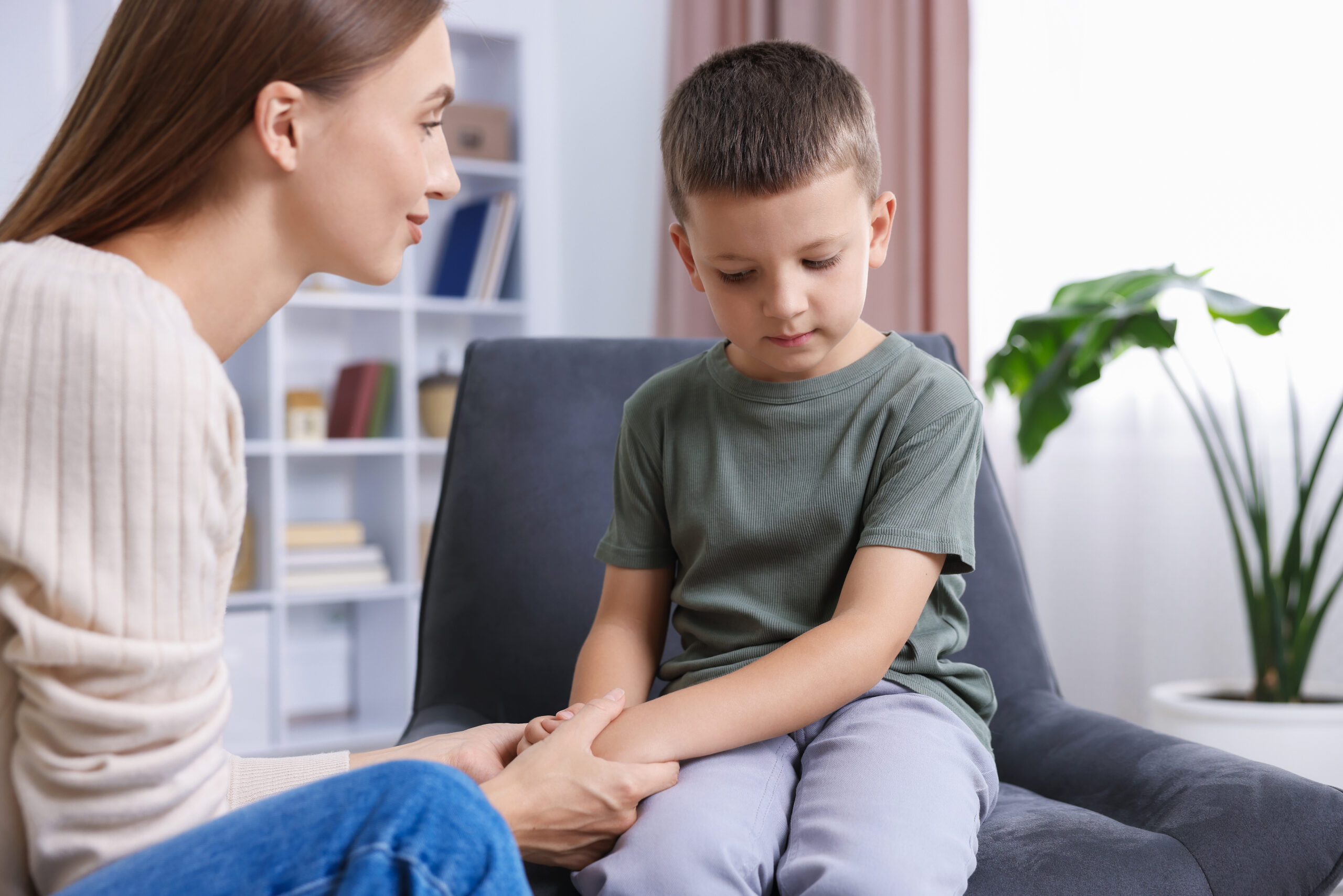A young boy checks off a colorful morning routine chart at his desk in The Woodlands This visual demonstrates practical tips on how to help a child with adhd stay organized at home