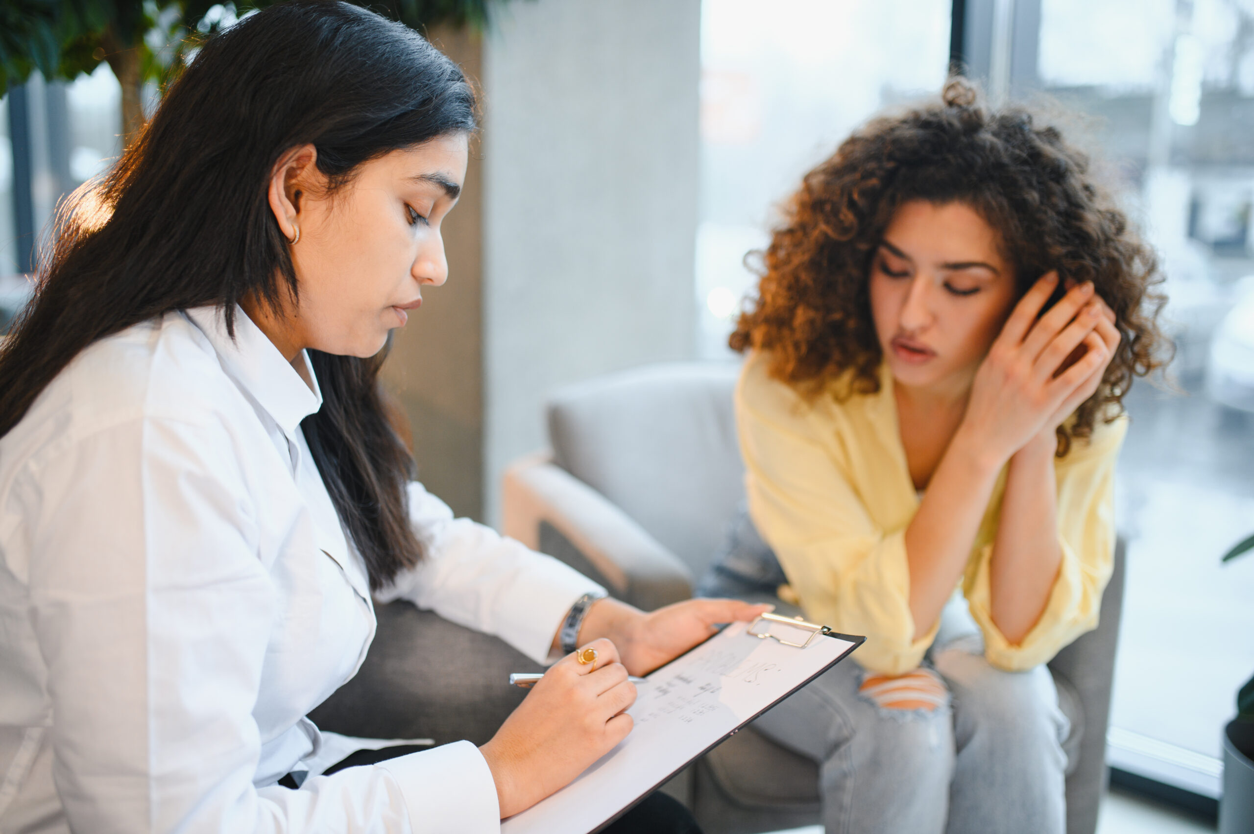 Therapist helping client manage stress through different types of therapy for anxiety