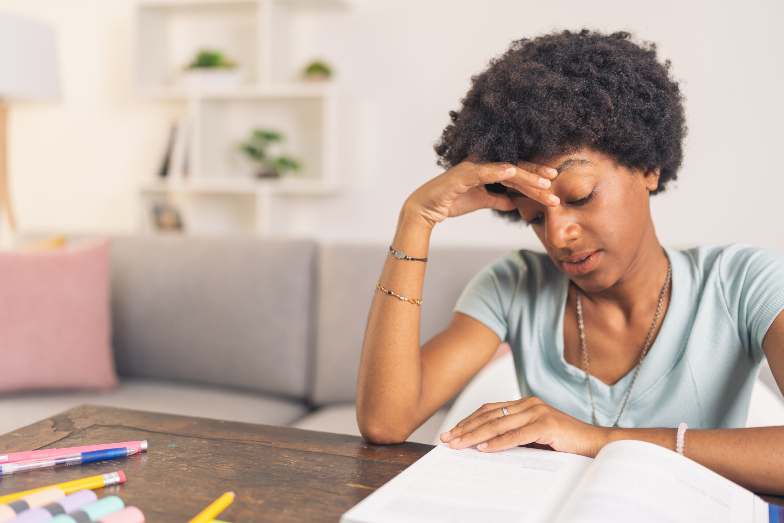 Young black woman concentrated reading a book Acceptance Path Counseling Highlights when to seek professional guidance and personalized adhd strategies for adults