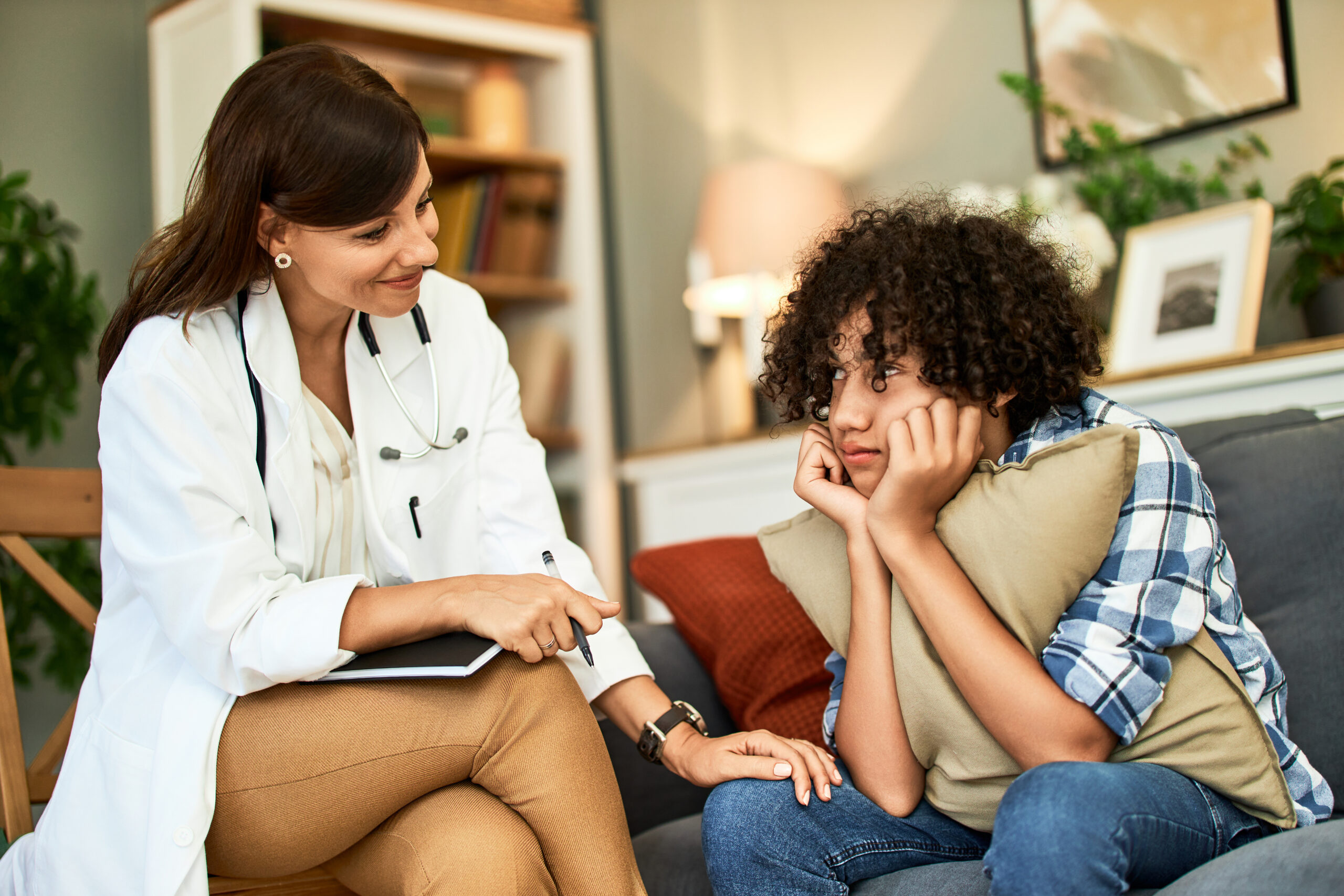 Adult meeting with a trauma informed counselor to discuss emotional healing and recovery