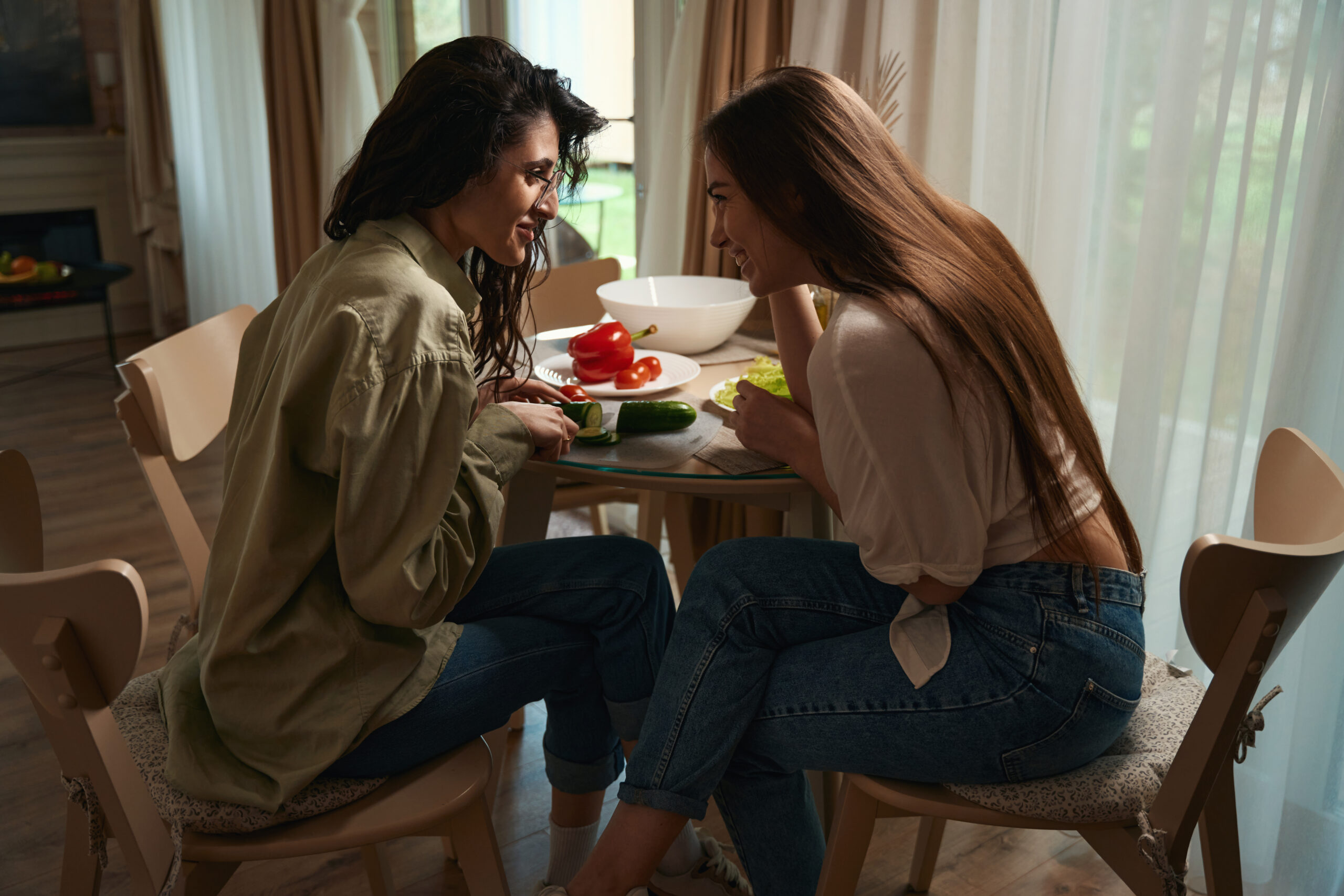 Female friends spend time at table in the kitchen Acceptance Path Counseling Gentle conversation strategies for supporting someone with an eating disorder