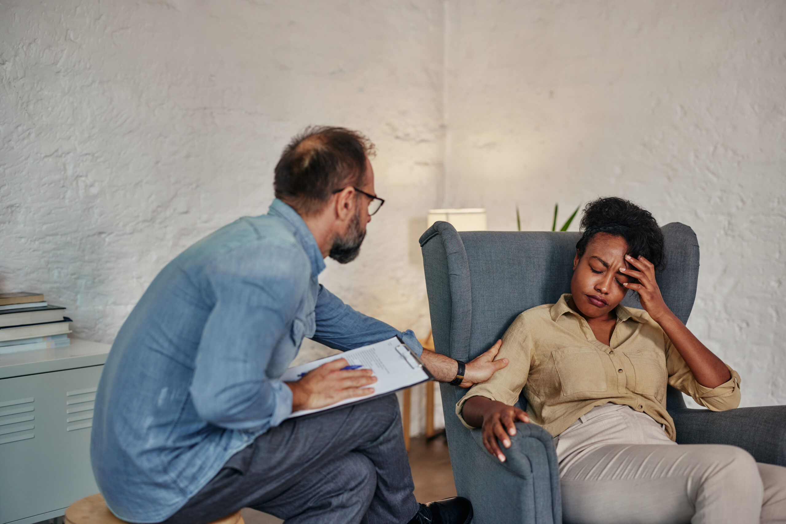 Caring counselor listening to female patient Acceptance Path Counseling Supportive trauma focused therapy environment designed for emotional wellness and growth