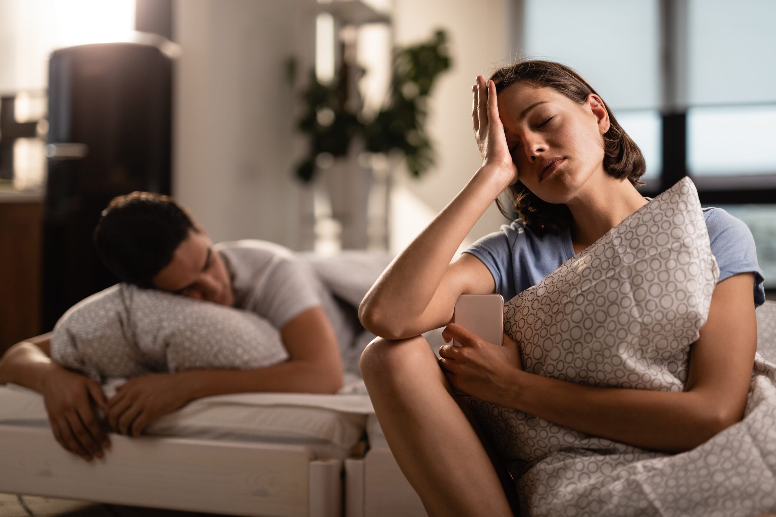 Person reflecting on early warning signs of bipolar disorder symptoms