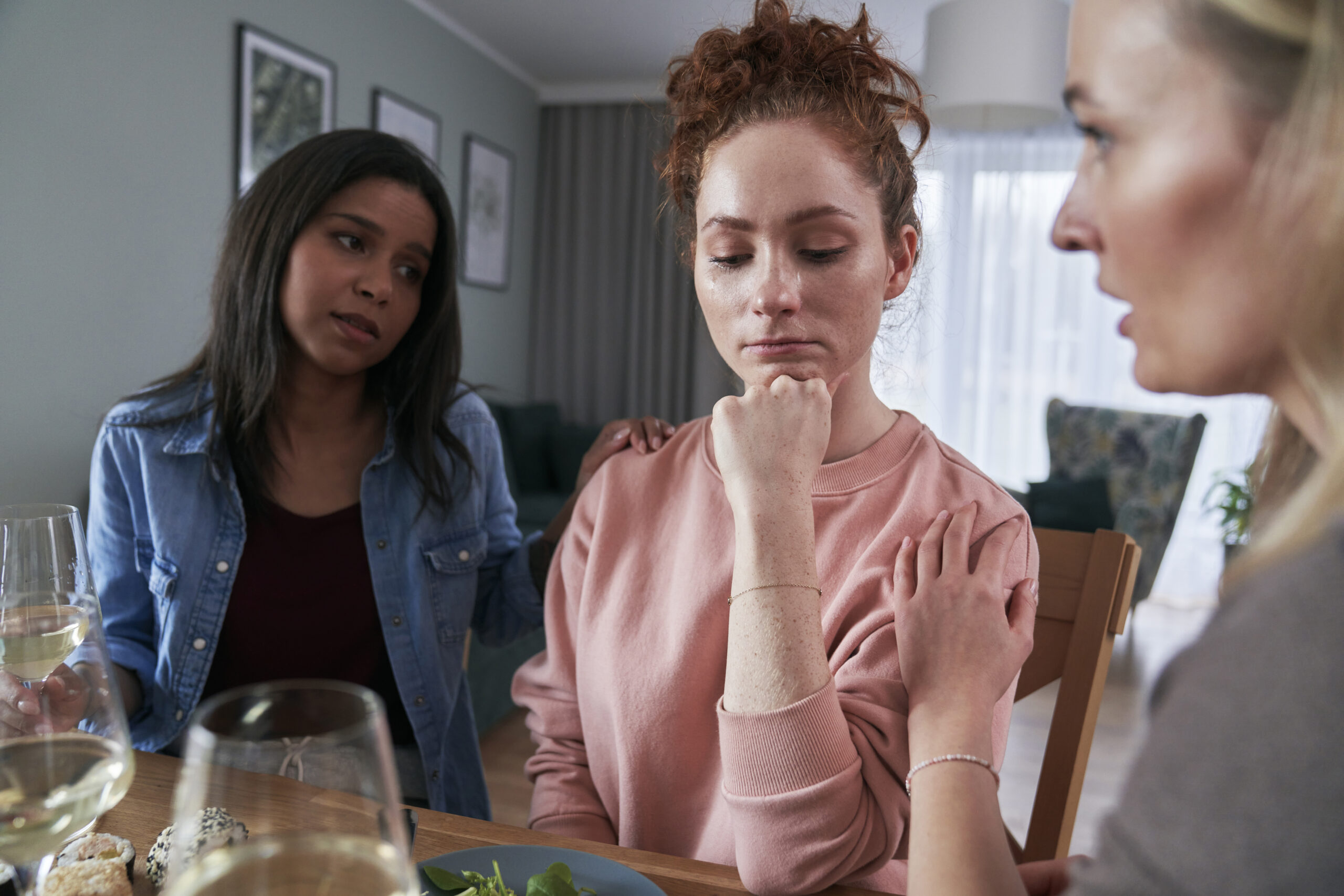 Three female caucasian friends chatting over problems at home Acceptance Path Counseling A supportive discussion approach for someone struggling with an eating disorder