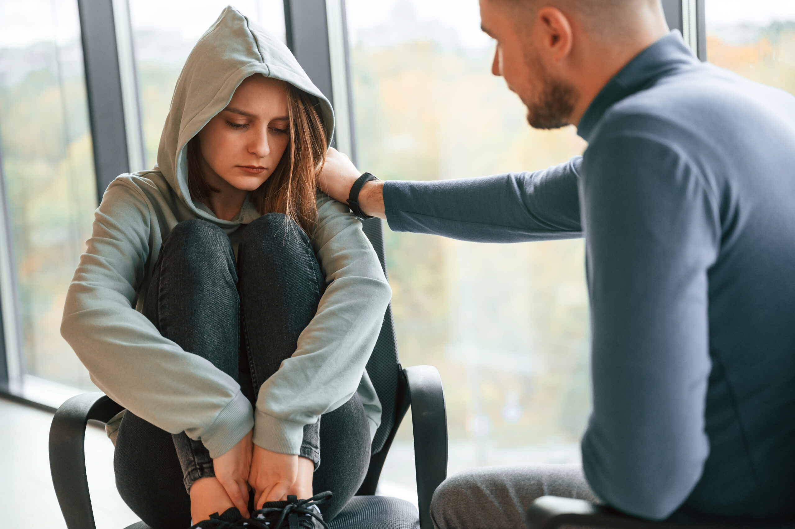 Therapist discussing how does trauma therapy work and supporting emotional healing