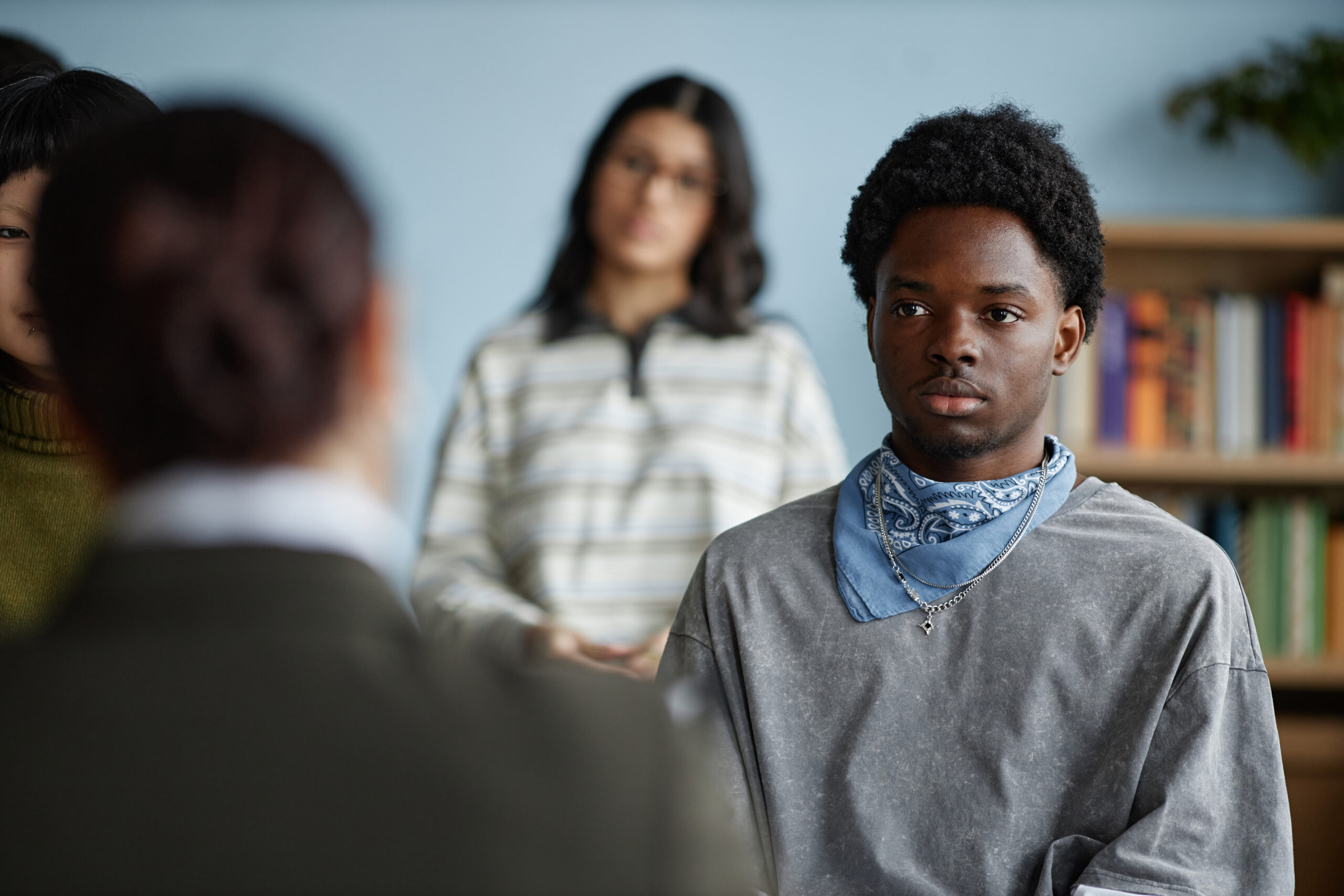 A high achieving adult sitting confidently in a bright room representing a nuanced perspective on mental health management and whether is BPD a disability
