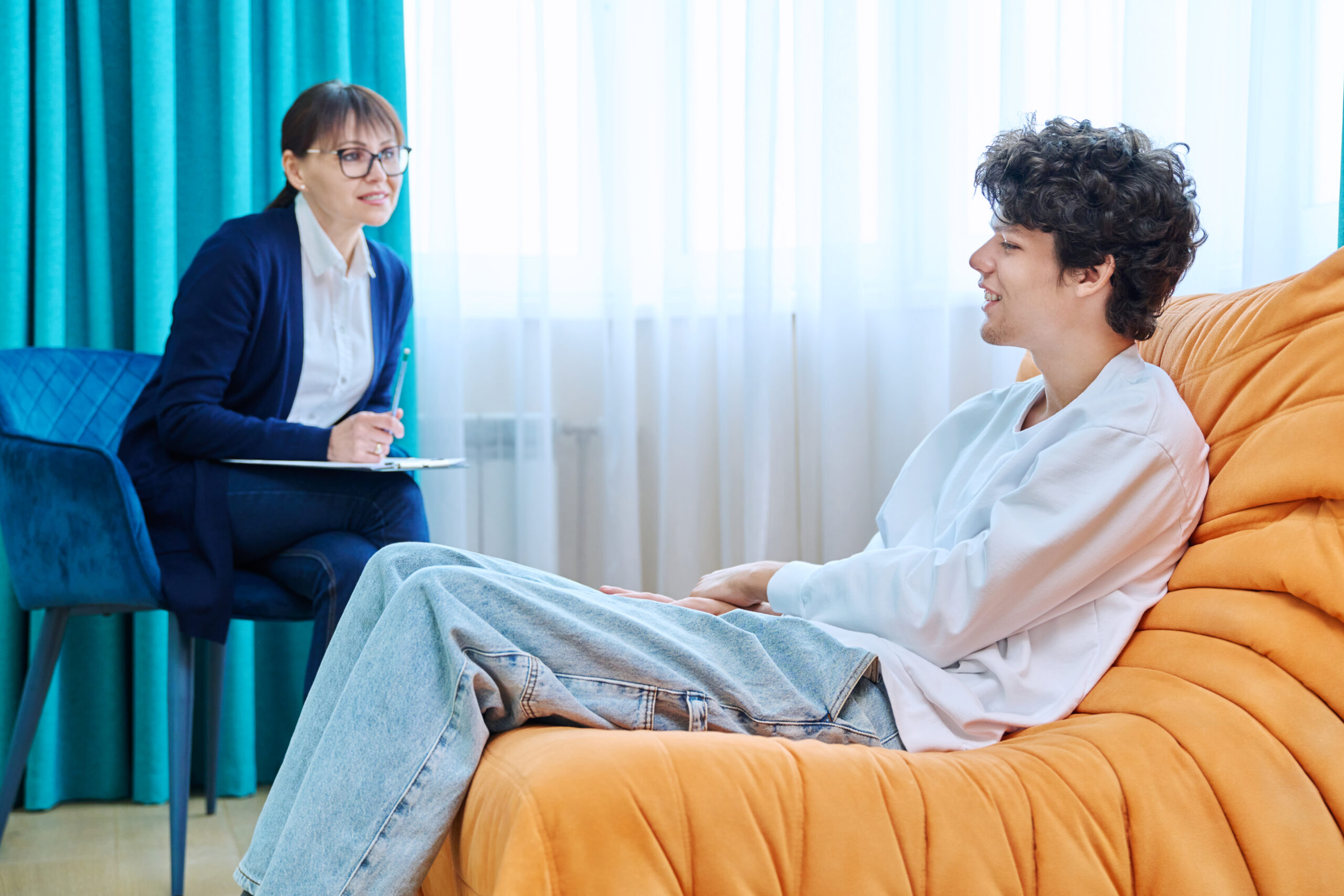 Young guy in therapy discussing his problems with female psychotherapist Acceptance Path Counseling Visual representation of bipolar disorder affecting mood energy and daily life