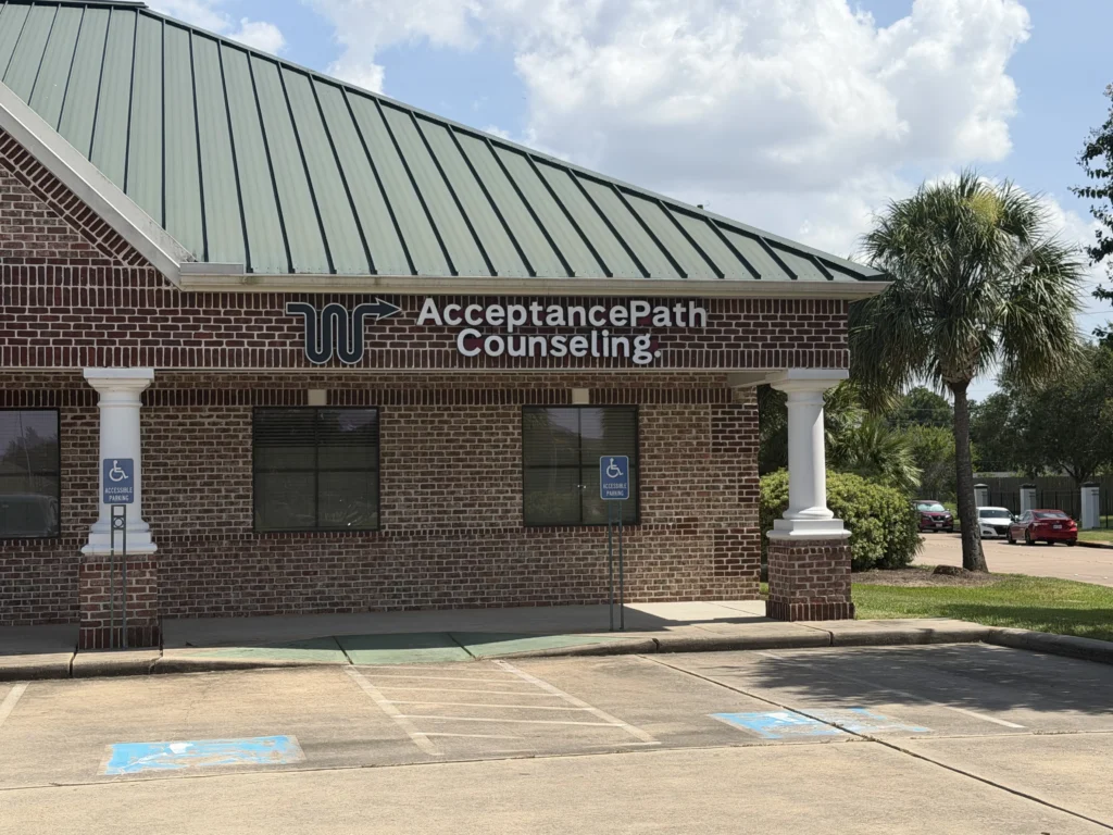 Counseling center in a brick building with an Acceptance Counseling sign and accessible parking signs in front