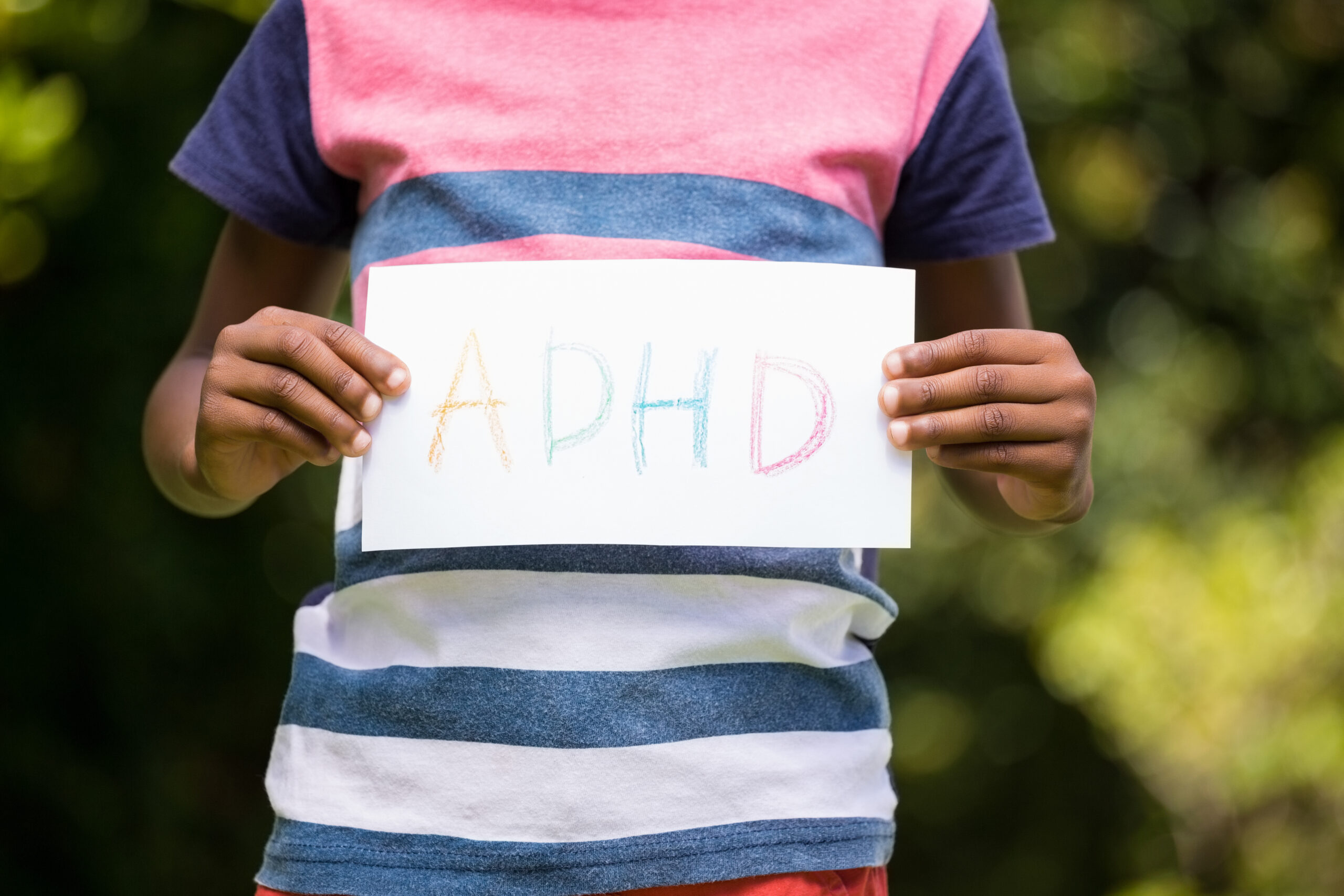 boyshowingaposterwithadhdinthepark20260111103124utc Acceptance Path Counseling Person experiencing overlapping ADHD and depression symptoms while struggling to begin daily tasks