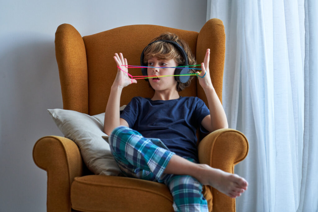 Person feeling overwhelmed by noise, notifications, and competing demands during ADHD overstimulation