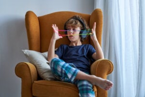 Person feeling overwhelmed by noise notifications and competing demands during ADHD overstimulation