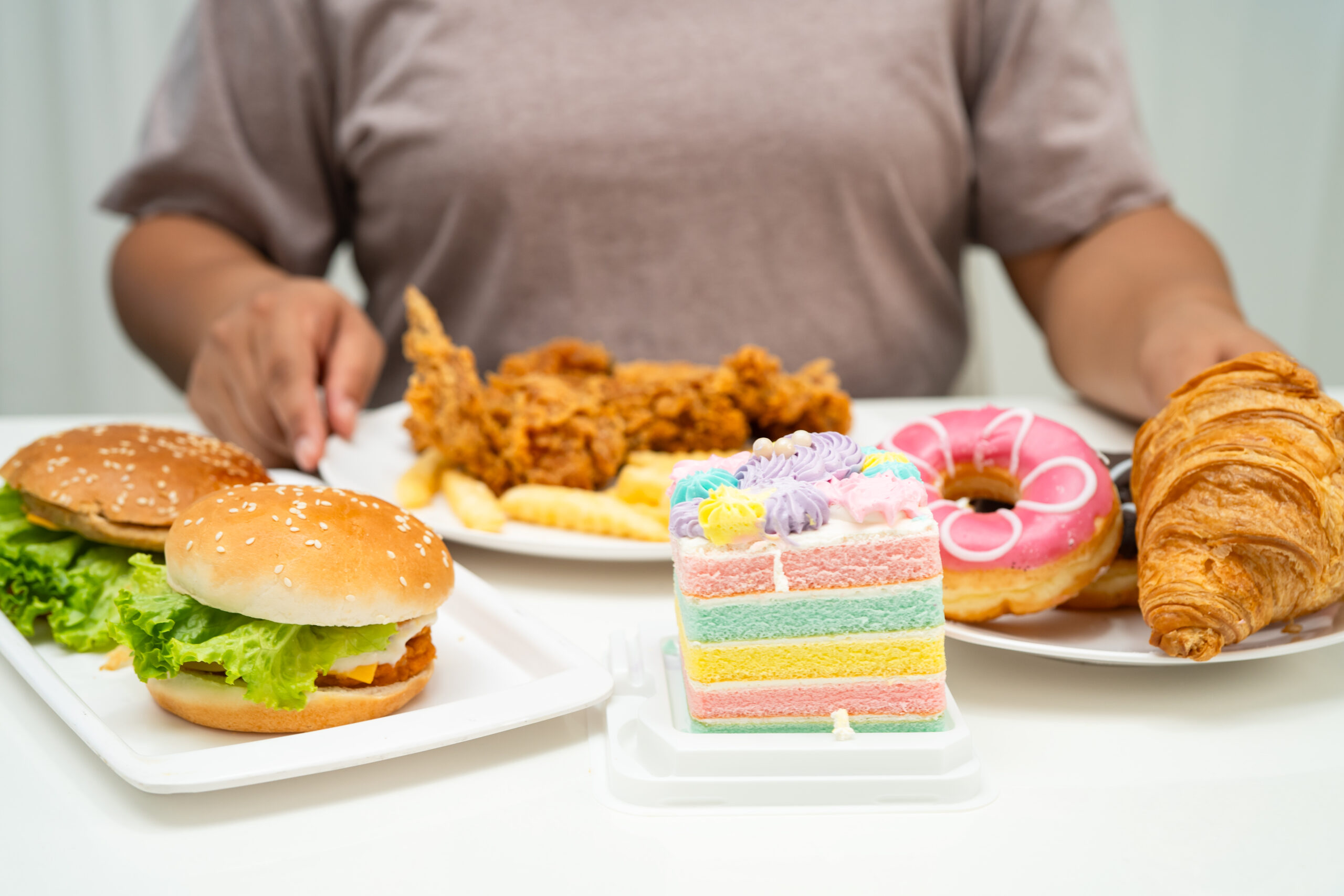Person privately reflecting on loss of control eating and other signs and symptoms of binge eating disorder