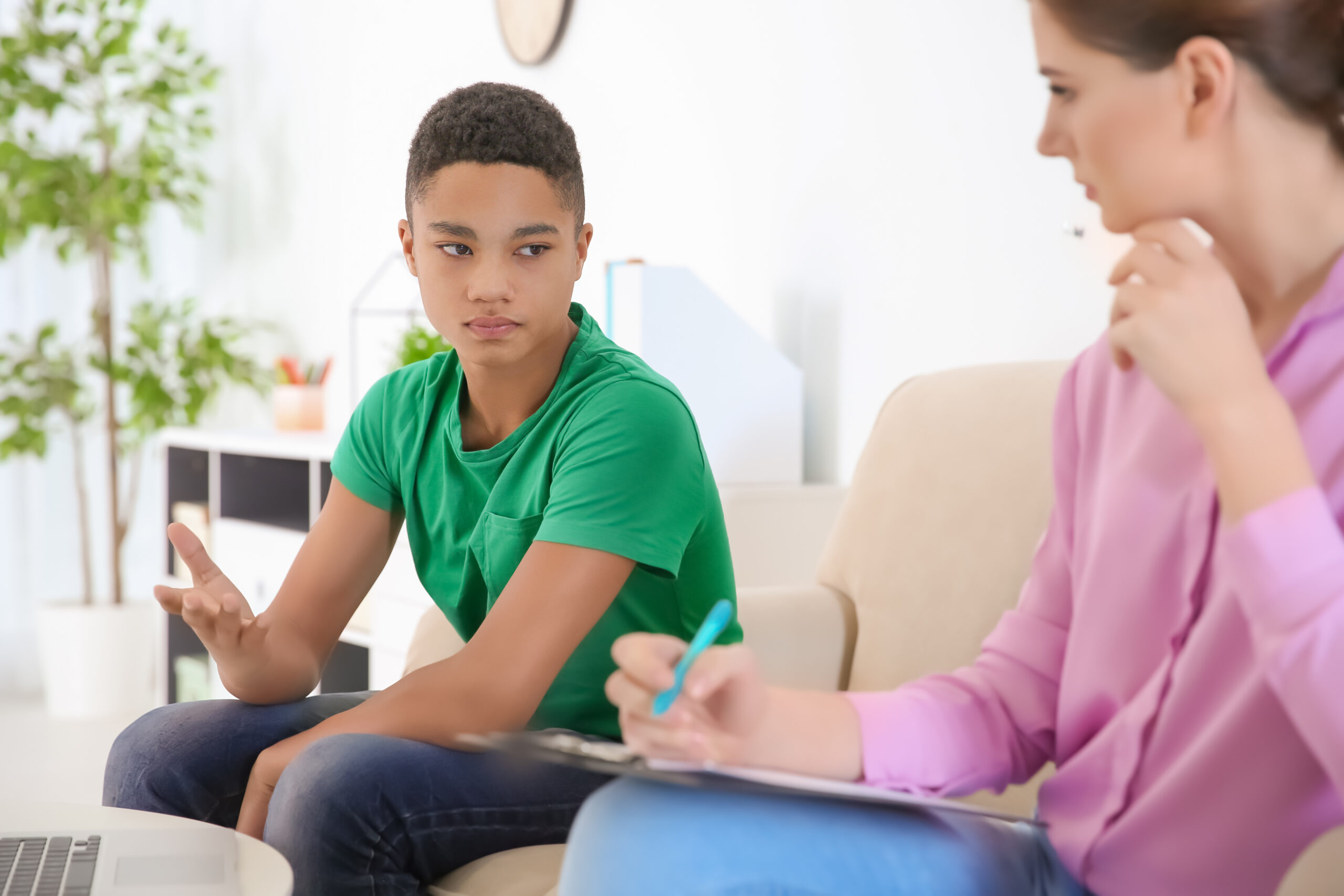 Therapist helping a client identify triggers and early signs of ADHD overstimulation