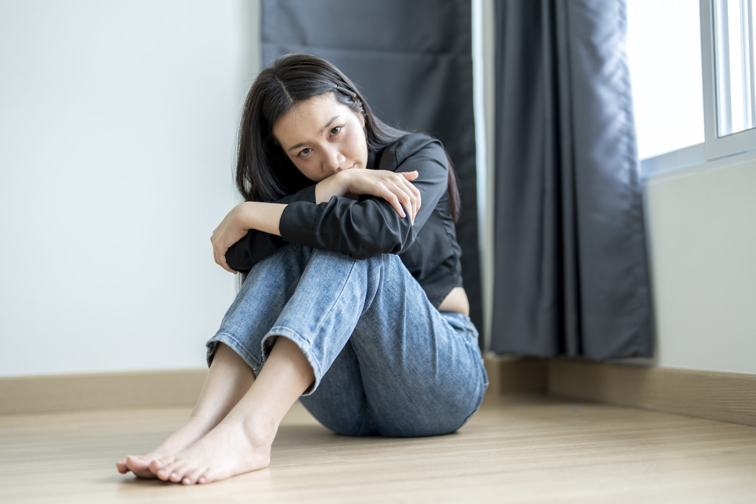 Individual person maintaining a positive appearance despite the hidden effects of smiling depression