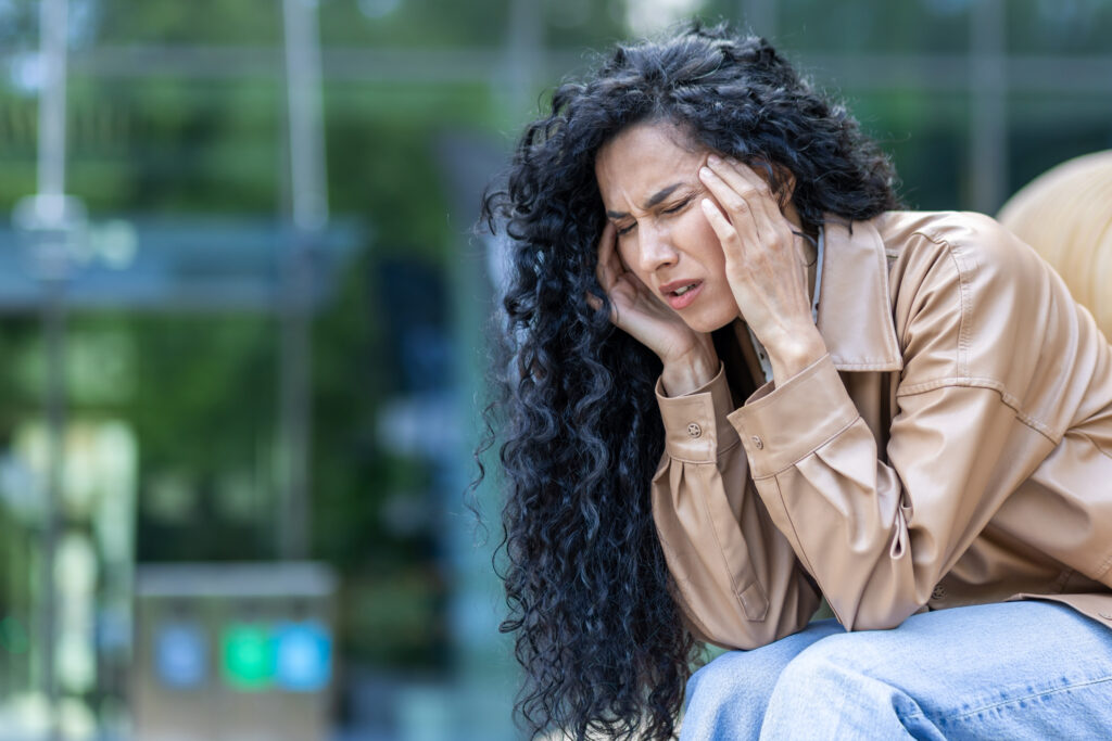 Person experiencing physical symptoms of anxiety, including chest tightness and a racing heartbeat