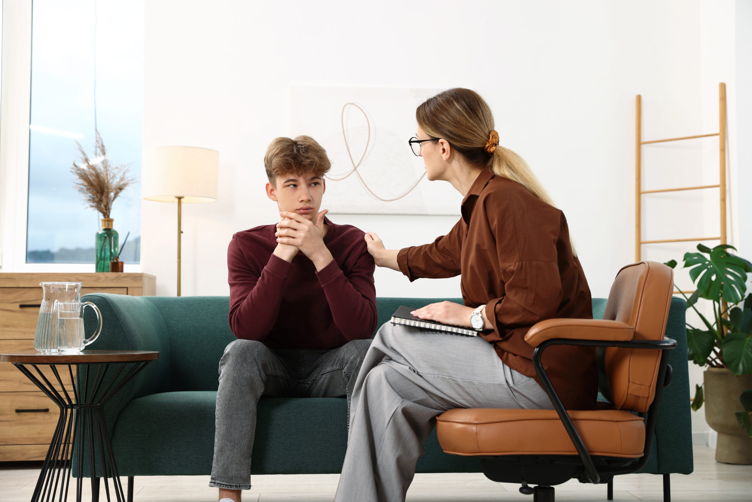 Therapist discussing bipolar disorder test results and recurring mood changes with a client