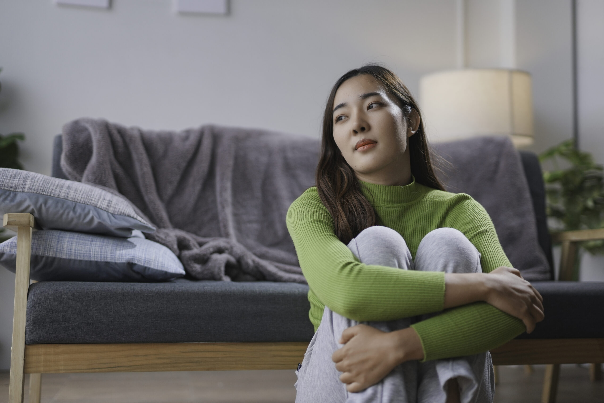 Individual noticing physical symptoms of anxiety during a stressful moment