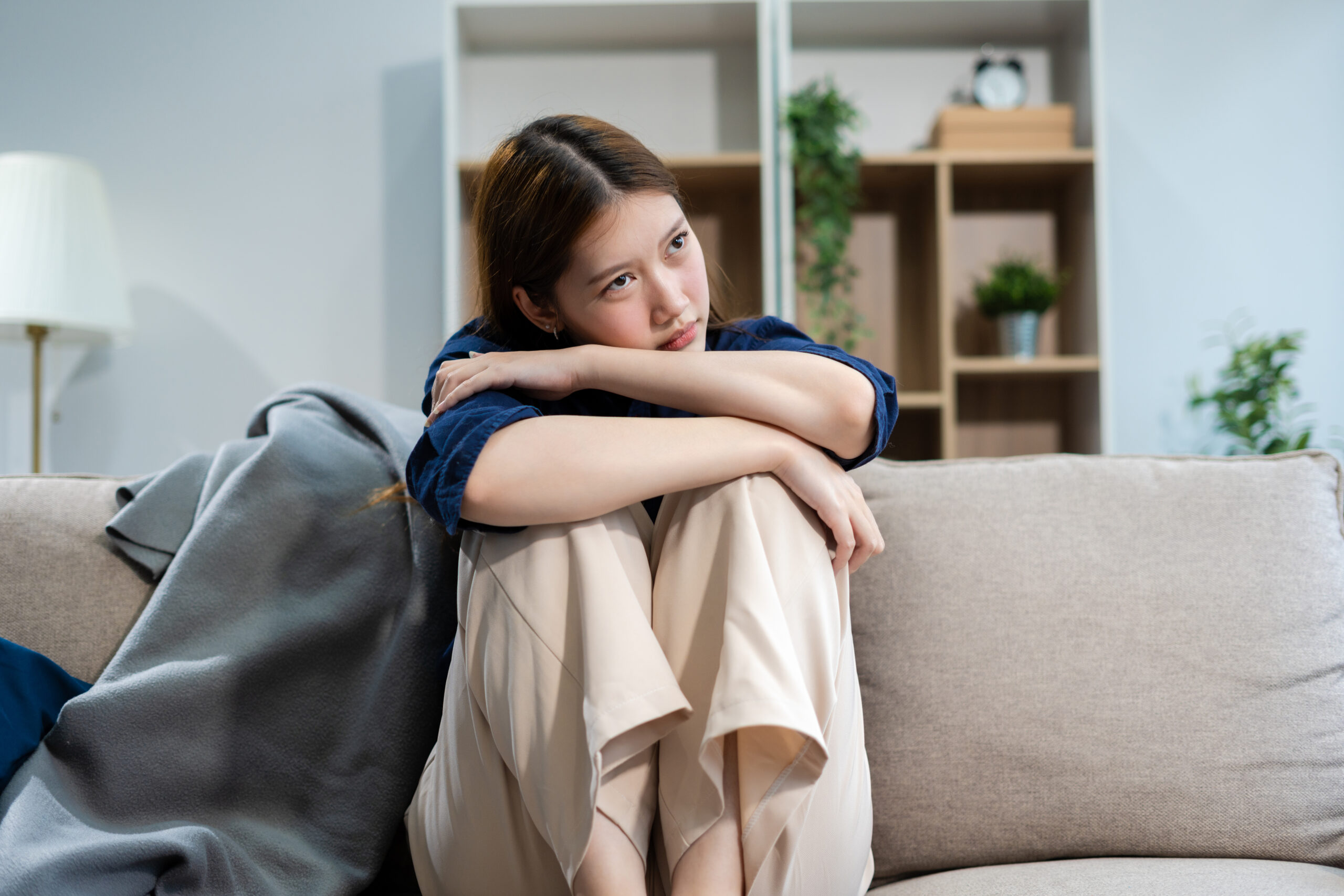 Person experiencing health anxiety while closely monitoring an ordinary physical sensation