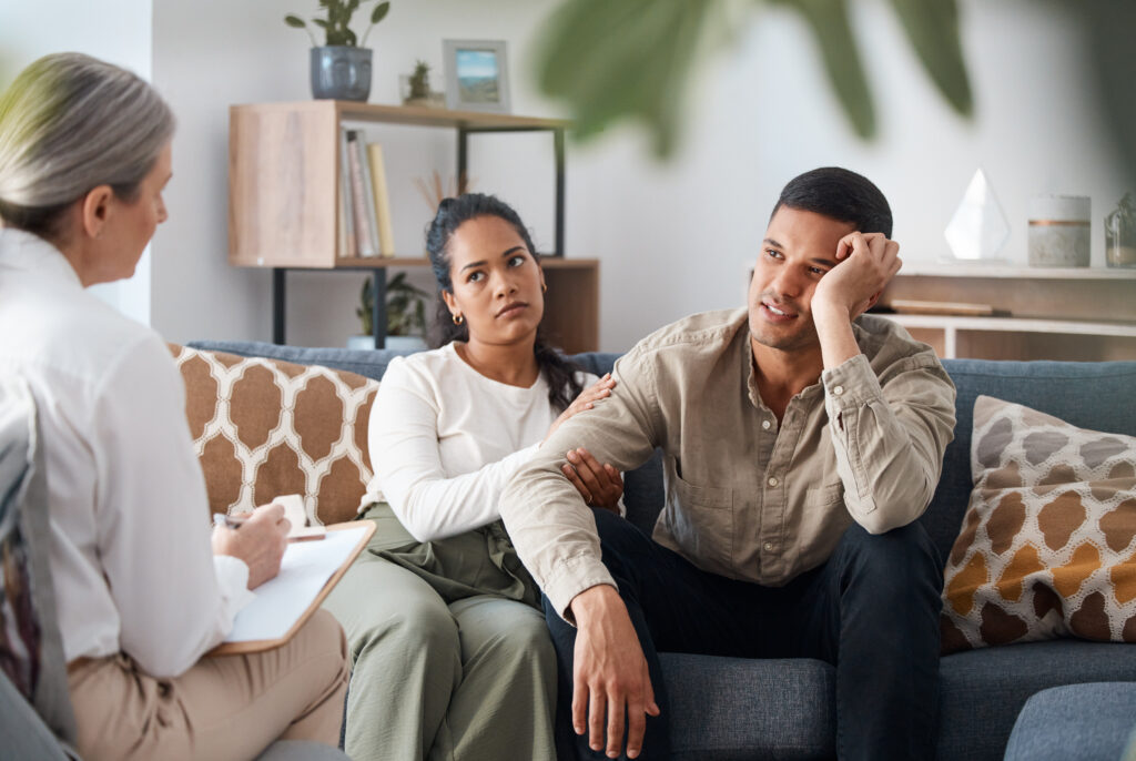 Person feeling overwhelmed by unfinished tasks related to depression and procrastination.