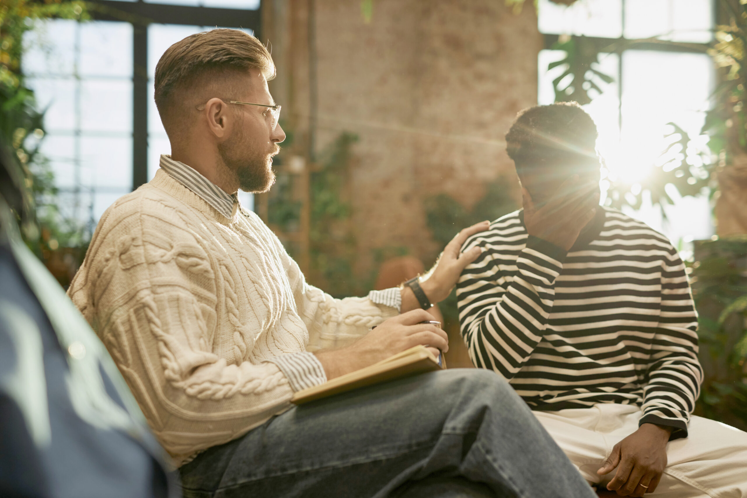Male psychologist supporting client Acceptance Path Counseling Counseling session supporting a Firethorne resident with depression and procrastination