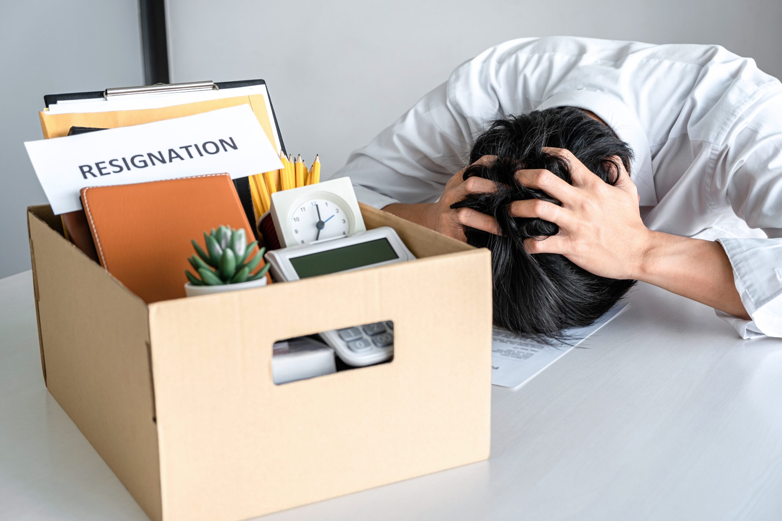 Images of packing up all his personal belongings and files into Acceptance Path Counseling Adult struggling to begin work while experiencing depression and low motivation