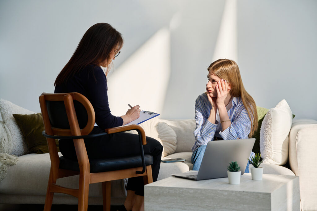 Person waking suddenly in bed while experiencing symptoms of a nocturnal panic attack.