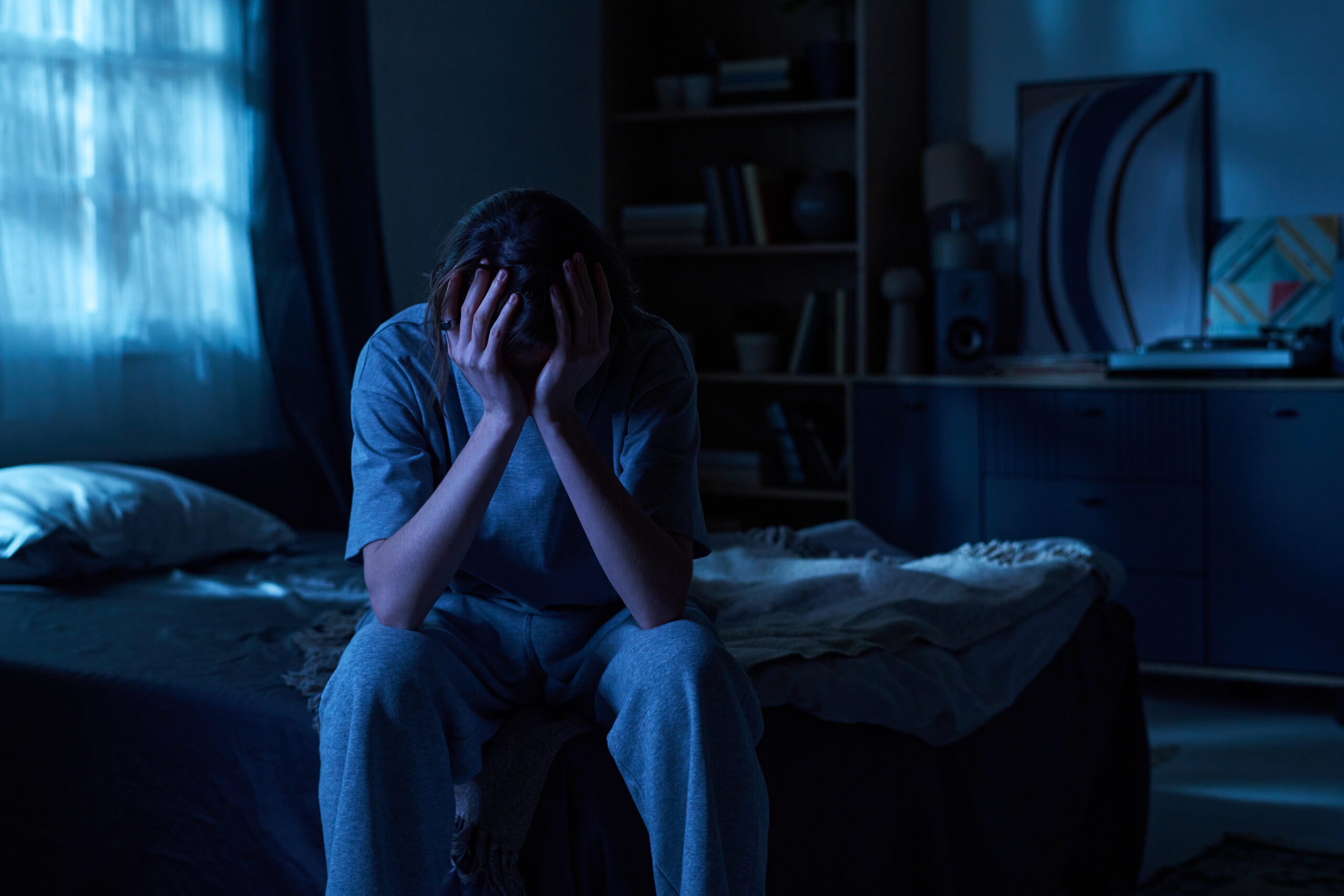 Person waking suddenly after experiencing a distressing PTSD nightmare