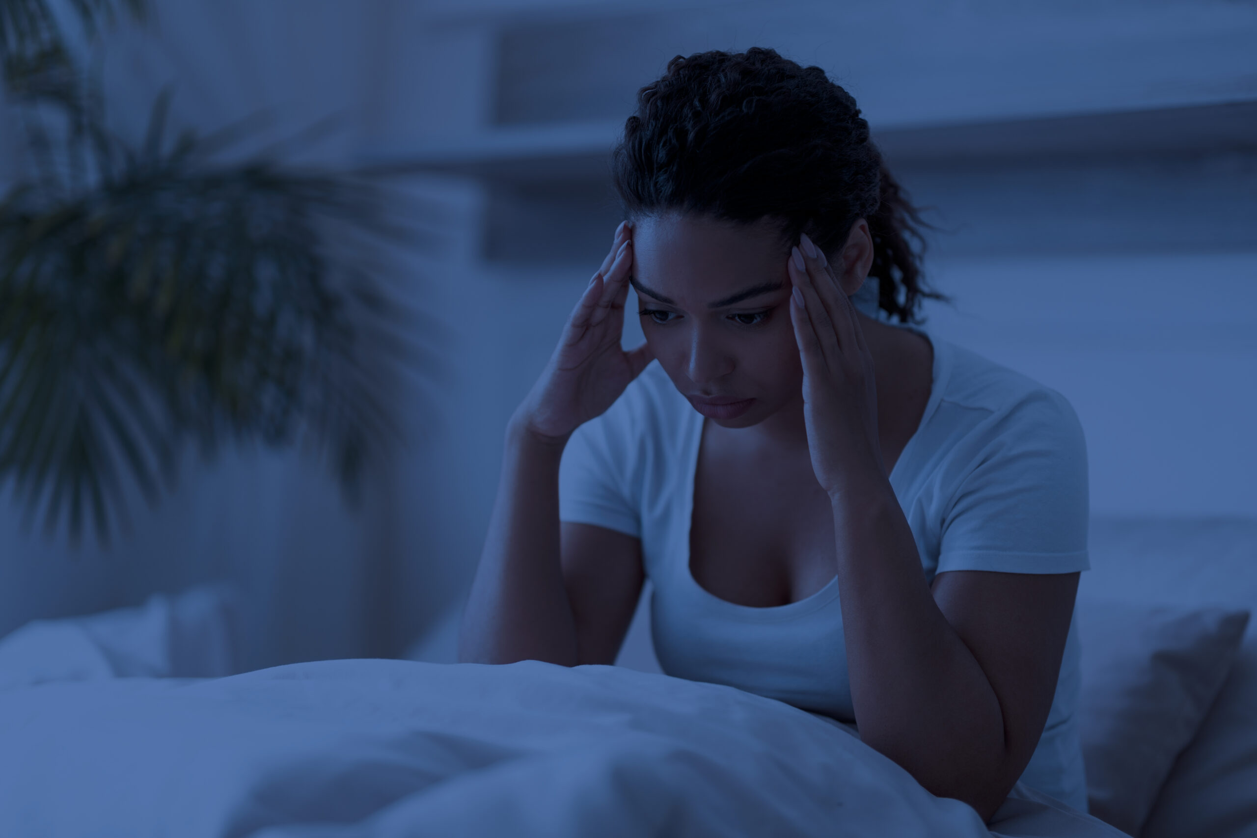 Person using a quiet bedtime routine to respond to nighttime anxiety