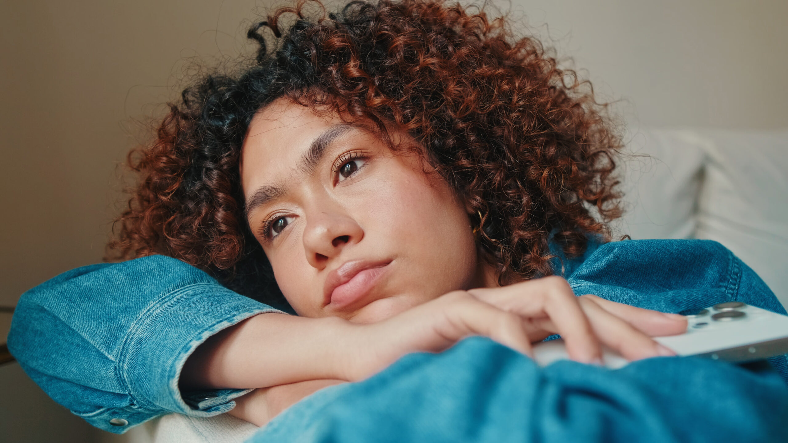 Sleepless person monitoring their heartbeat after waking with nocturnal panic symptoms