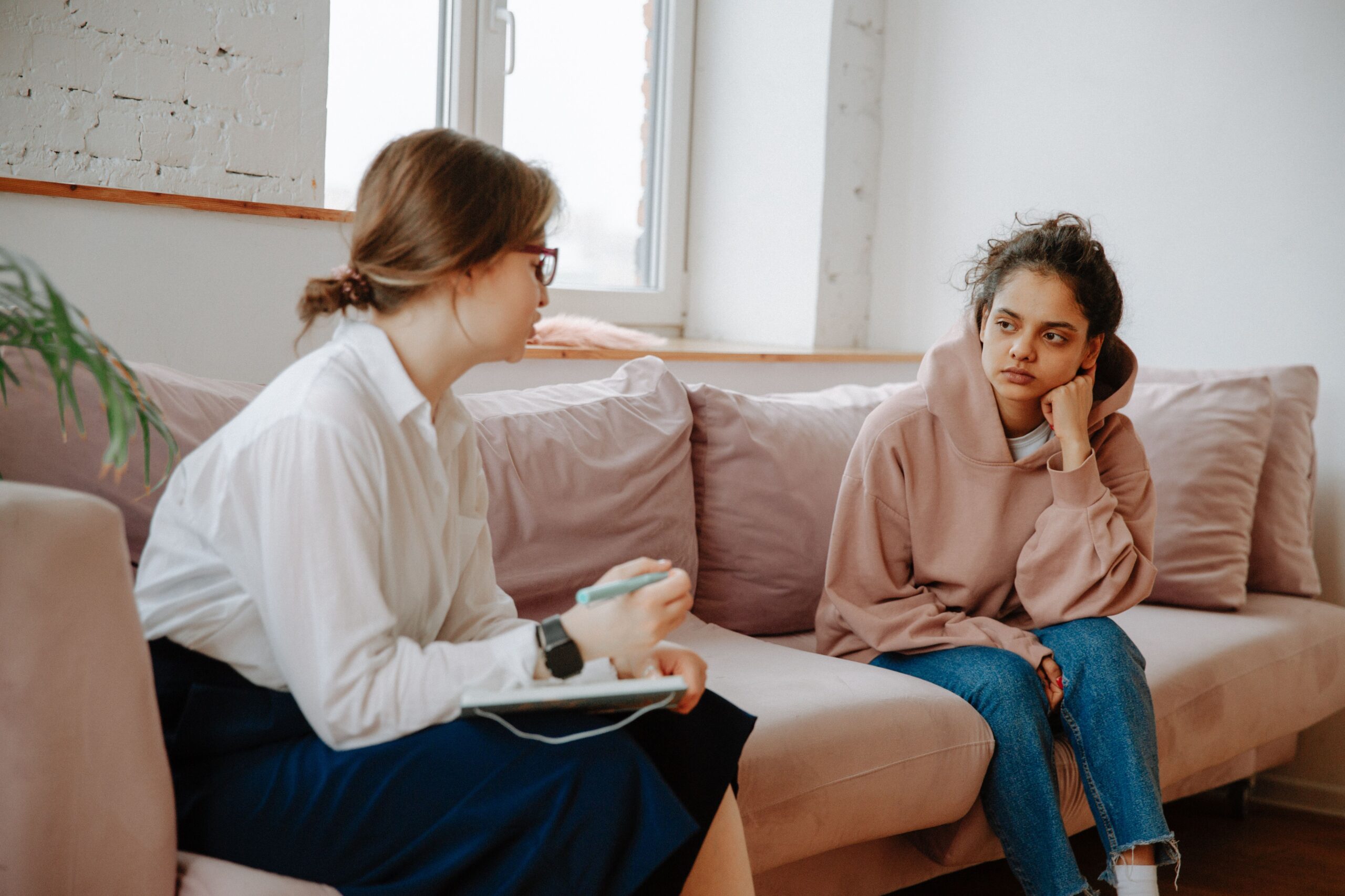 Counselor listening as an adult client shares their concerns